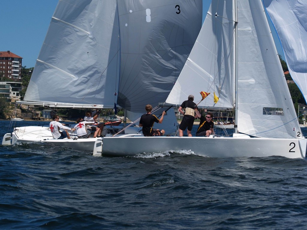 Gybing for the for the bottom mark Junior (boat 2) vs Walker © Aline Van Haren 
